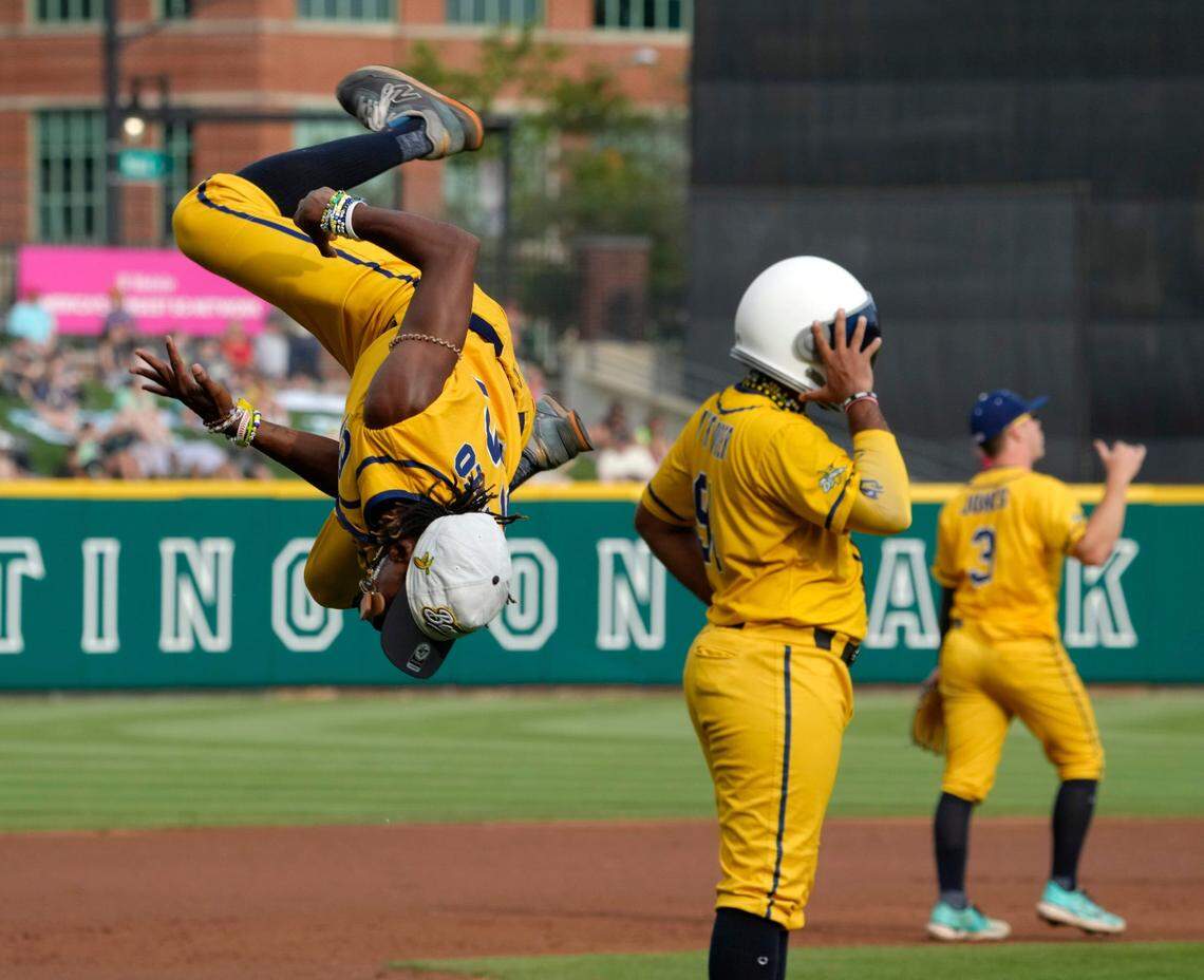 Savannah Bananas first base coach Maceo Harrison does a flip before a game of Banana Ball against the Party Animals in front of a sold-out crowd at Huntington Park on May 24, 2024.