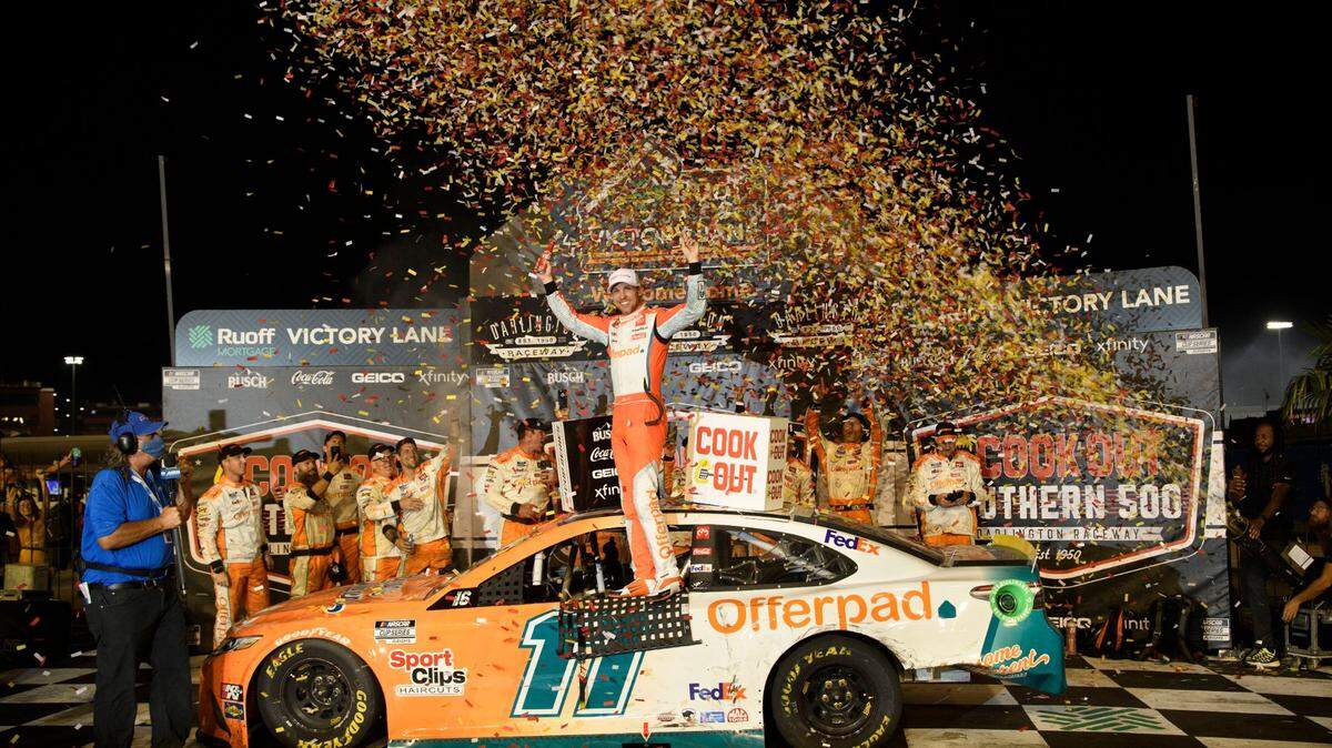 Denny Hamlin celebrates in victory lane after winning a NASCAR Cup Series auto race Sunday, Sept. 5, 2021, in Darlington, S.C. (AP Photo/John Amis)