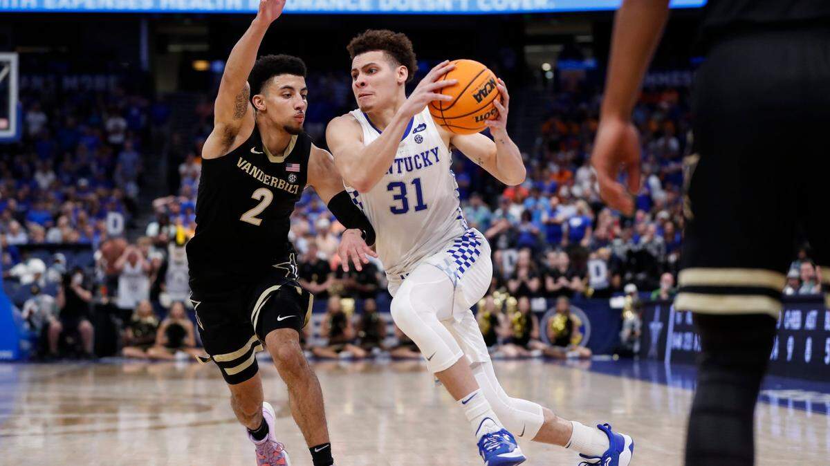 Kentucky Wildcats guard Kellan Grady (31) drives to the basket past Vanderbilt Commodores guard Scotty Pippen Jr. (2) during the SEC Men’s Basketball Tournament at Amalie Arena in Tampa, Fl., Friday, March 11, 2022.