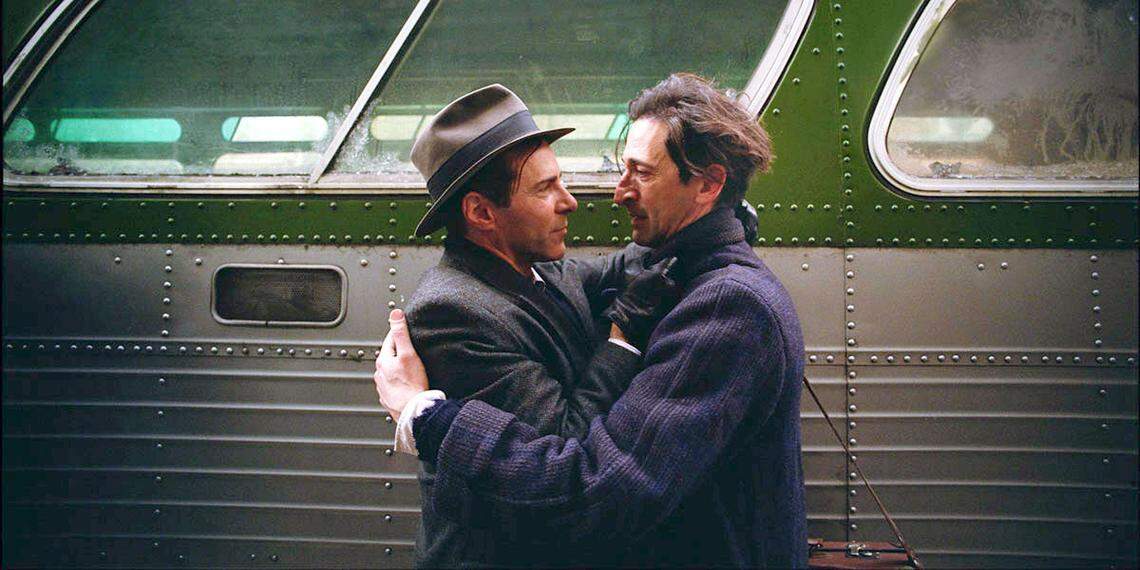 Alessandro Nivola and Adrien Brody in “The Brutalist.”