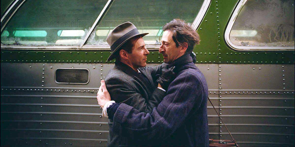 Alessandro Nivola and Adrien Brody in “The Brutalist.”