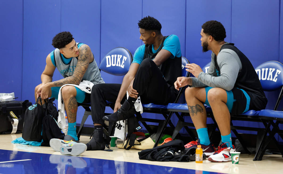 Charlotte Hornets’ K.J. Simpson (25), Brandon Miller (24) and Miles Bridges (0) talk after their practice at the Michael W. Krzyzewski Center at Duke University in Durham, N.C., Tuesday, Oct. 1, 2024.