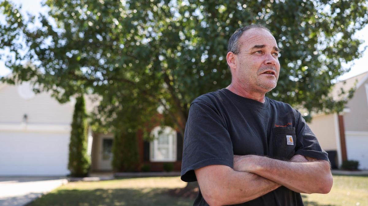 Eric Peper stands outside the house in southwest Charlotte that he used to own before his HOA foreclosed on him. “I’ll never live in a neighborhood with an HOA again,” he said.