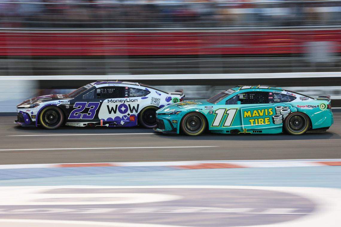 Bubba Wallace (23) pulls ahead of Denny Hamlin (11) heading into turn one during the Coca-Cola 600 at Charlotte Motor Speedway in Concord on Sunday, May 26, 2024.