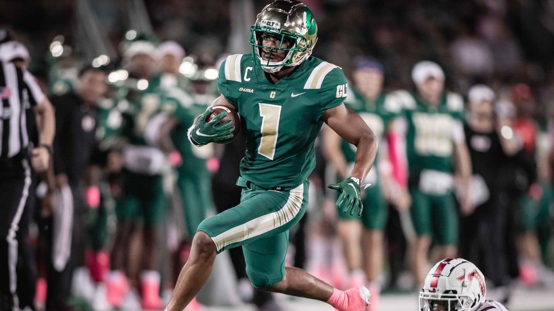 Charlotte’s Victor Tucker (1) gets by the defender and runs for the 1st down. Charlotte would host Florida Atlantic at Jerry Richardson Stadium Thursday October 21, 2021.