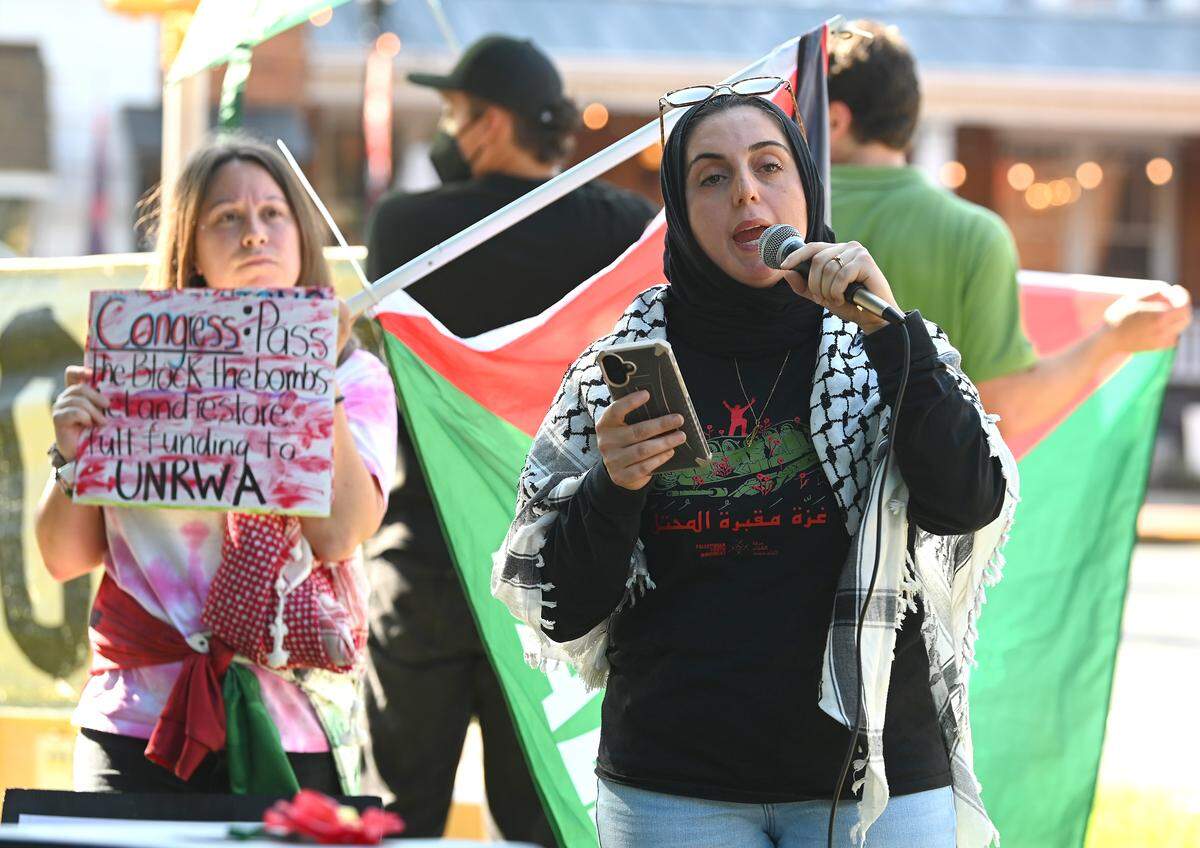Samira Haddad addresses the crowd during a “Bread Not Bullets” rally in Davidson, NC on Monday.