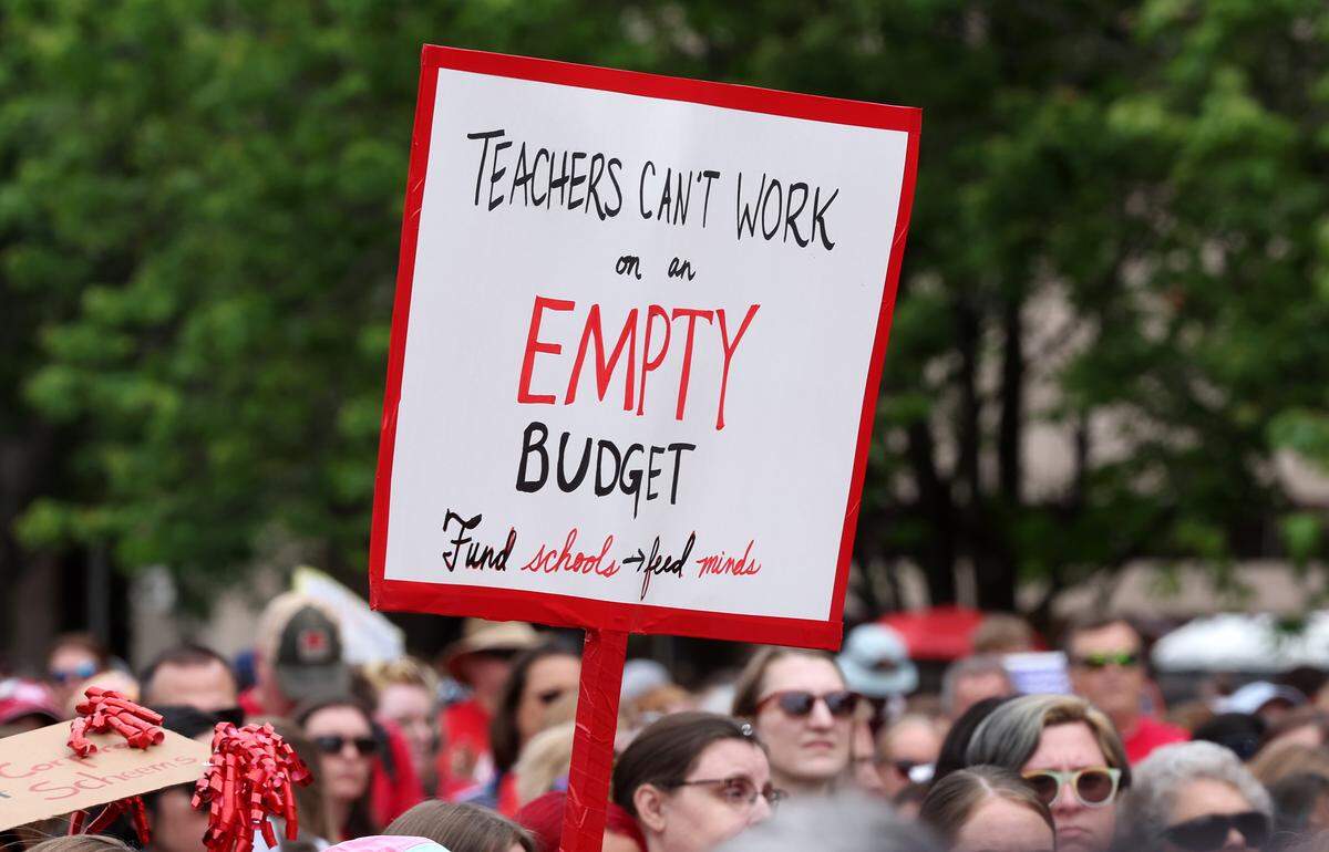 Signs, signs, signs were everywhere as teachers rallied at the Government Complex in Raleigh.