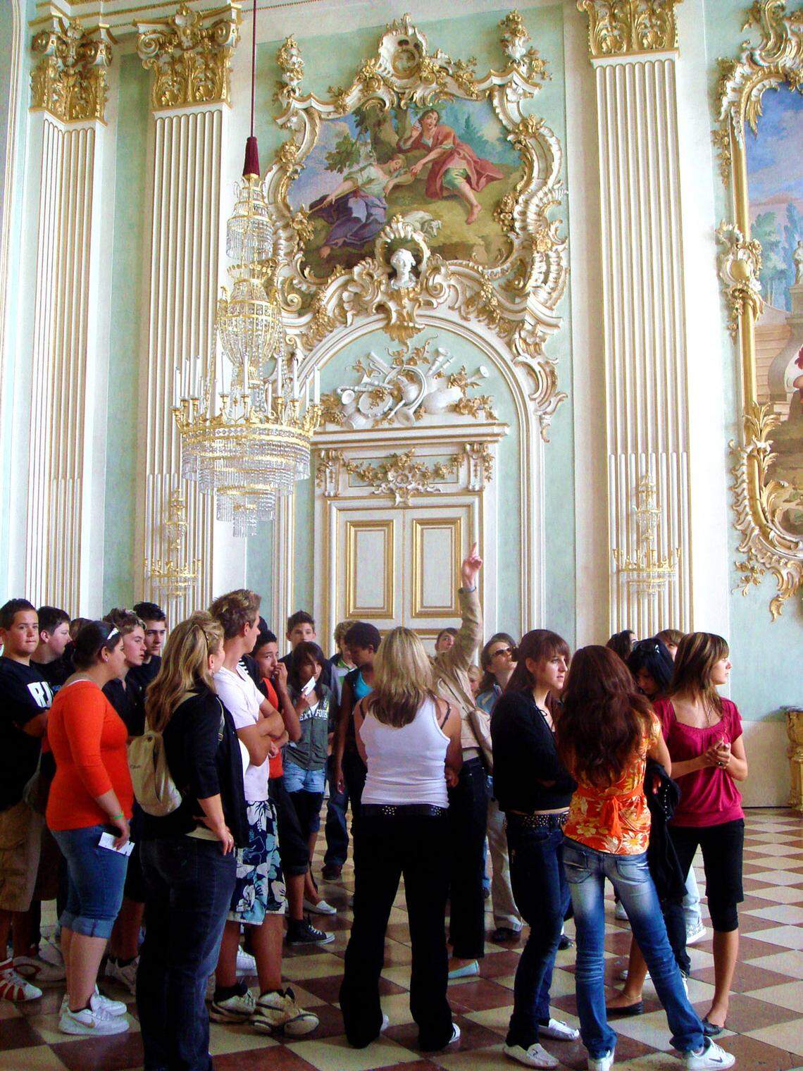 A group of students tours the Nymphenburg Palace on the outskirts of Munich. The Wittelsbach family, rulers of Bavaria for more than 700 years, built the palace to celebrate the birth of a royal heir. Travelers from Charlotte made the city one of their top international destinations.