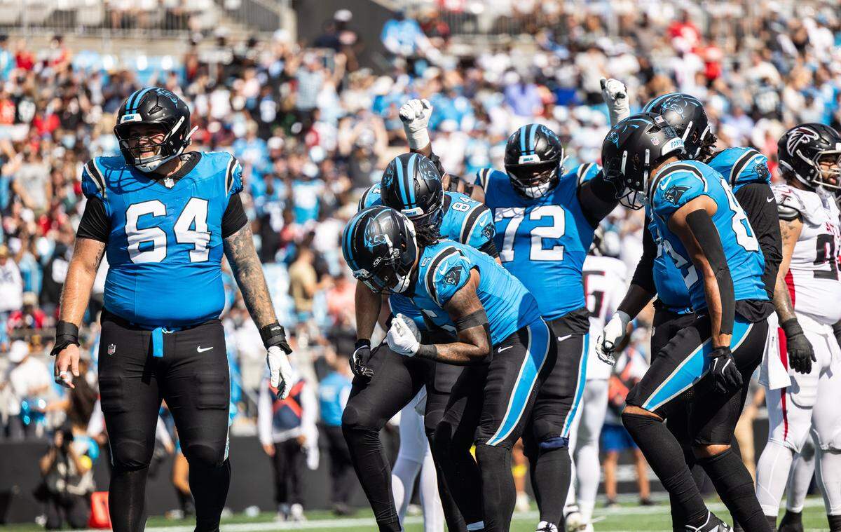 Carolina Panthers running back Rico Dowdle celebrates with teammates after making a touchdown against the Atlanta Falcons at the Bank of America Stadium in Charlotte on Sunday, September 21, 2025.