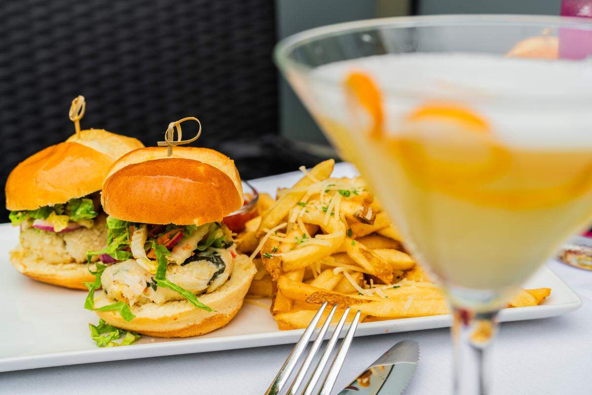 Sullivan’s Steakhouse serves crab cake sliders, made with two jumbo lump crab cakes, Napa slaw, roasted garlic tartar sauce on a brioche bun and served with garlic parmesan fries.