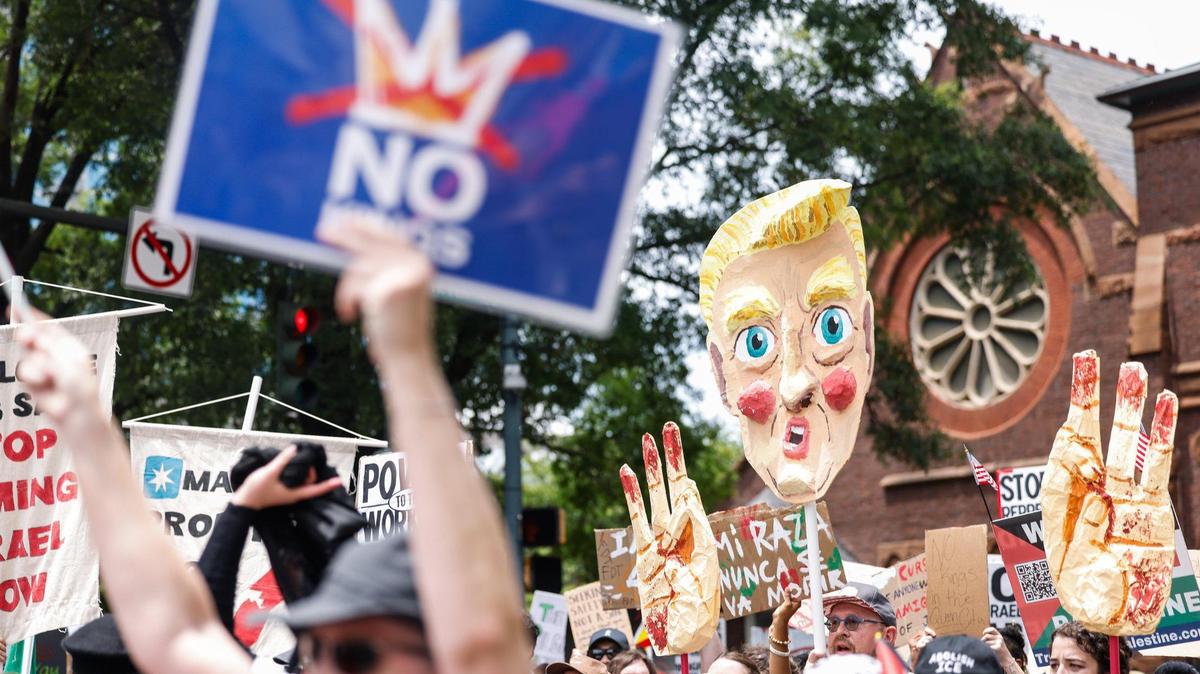 A “Trumpet,” a combination of Trump and puppet, is carried down North Tryon and West 7th streets during the “No Kings” protest in Charlotte on Saturday, June 14.