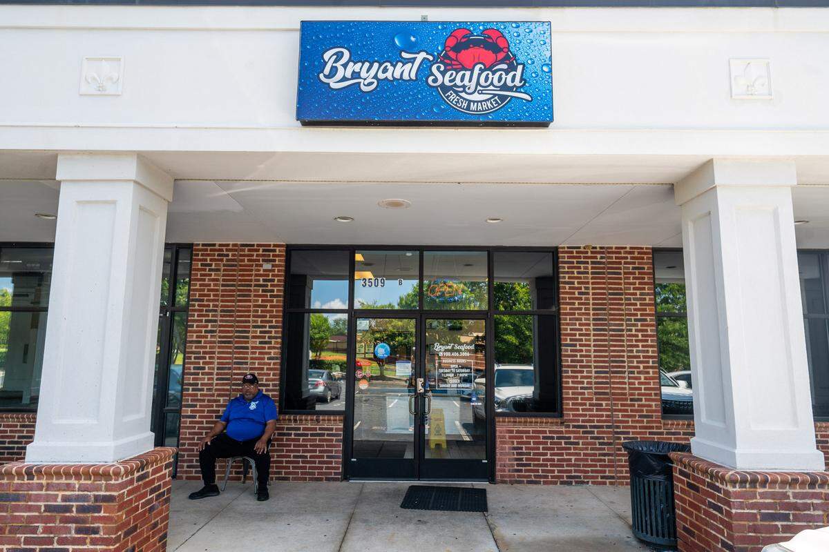 Big Wayne Bryant sat outside of Bryant Seafood Market.