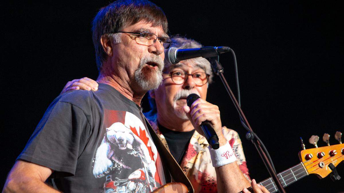Teddy Gentry, left, and Randy Owen perform “If You’re Gonna Play in Texas (You Gotta Have a Fiddle in the Band)” at Spectrum Center in Charlotte on Friday night.