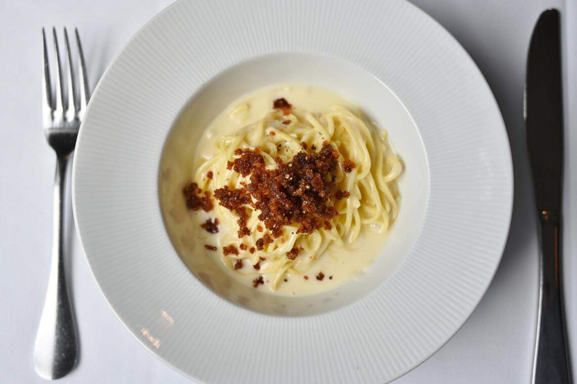 Aqua e Vino’s tajarin is fresh spaghettini bathed in Parmigiano fondue and topped with prosciutto de Parma.