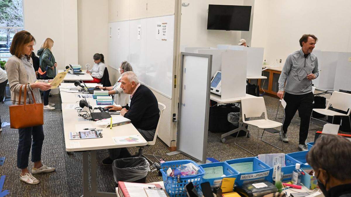 Election officials assist voters at South Park Library in Charlotte, NC on during early voting on Tuesday, February 28, 2024.