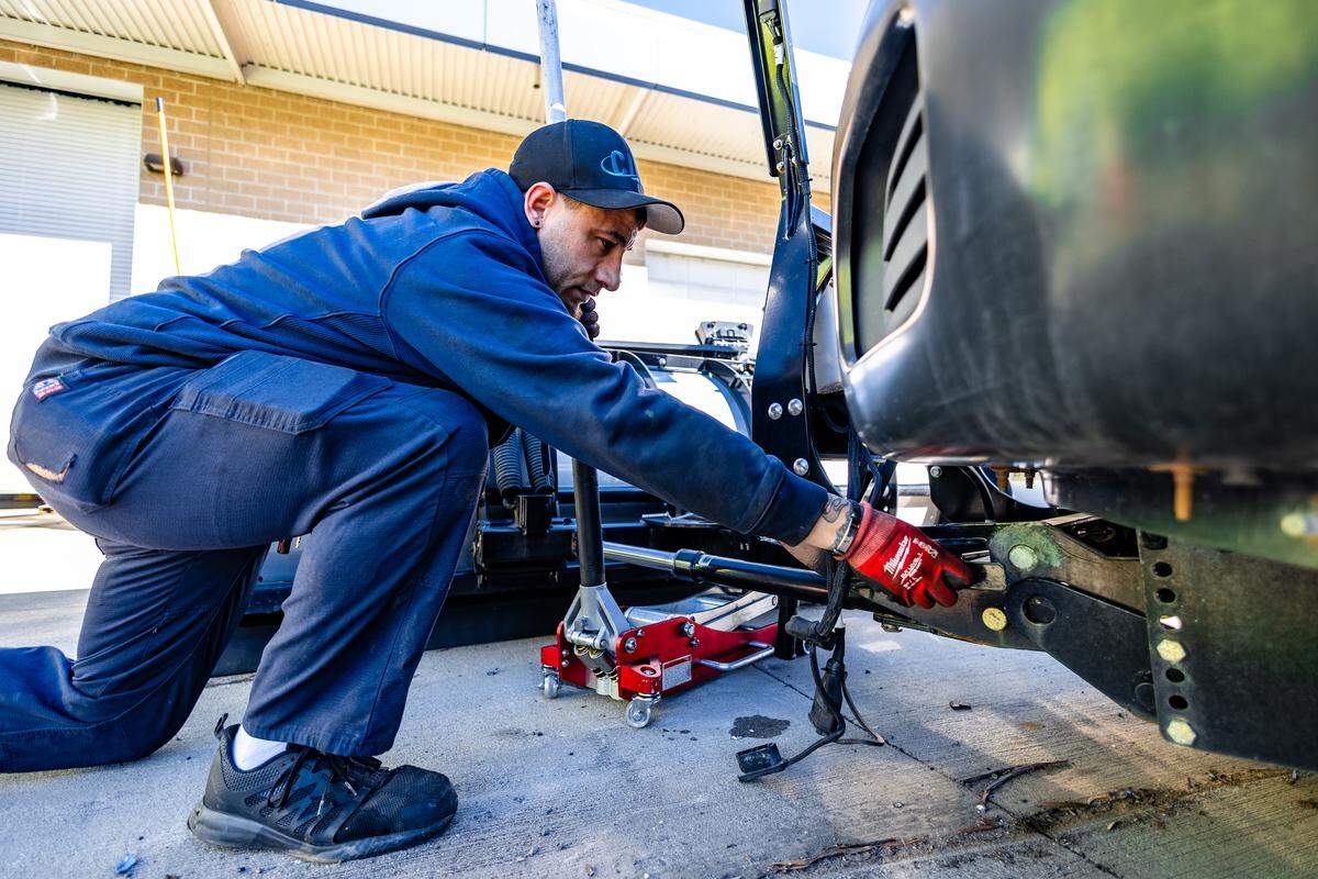 Workers at Charlotte Douglas International Airport preparing equipment ahead of Winter Storm Fern.