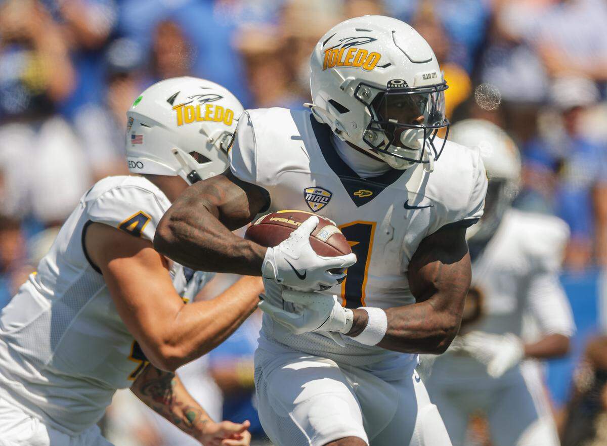 Toledo Rockets running back Chip Trayanum runs the ball during the first half against the Kentucky Wildcats at Kroger Field on Aug. 30, 2025, in Lexington, Kentucky. 
