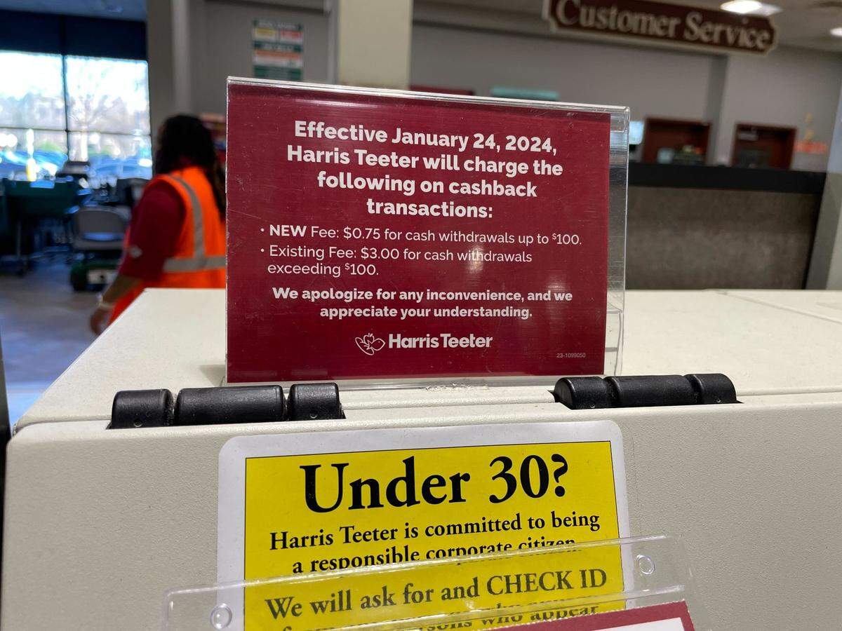 Harris Teeter has these signs in its stores alerting customers about the new cashback fees.