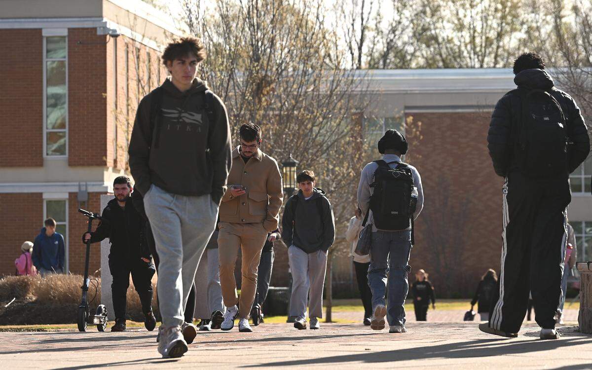 UNC Charlotte students walk to classes on Tuesday, March 17, 2026. Despite its size, density and growth, the University City area has not developed a good independent restaurant scene.