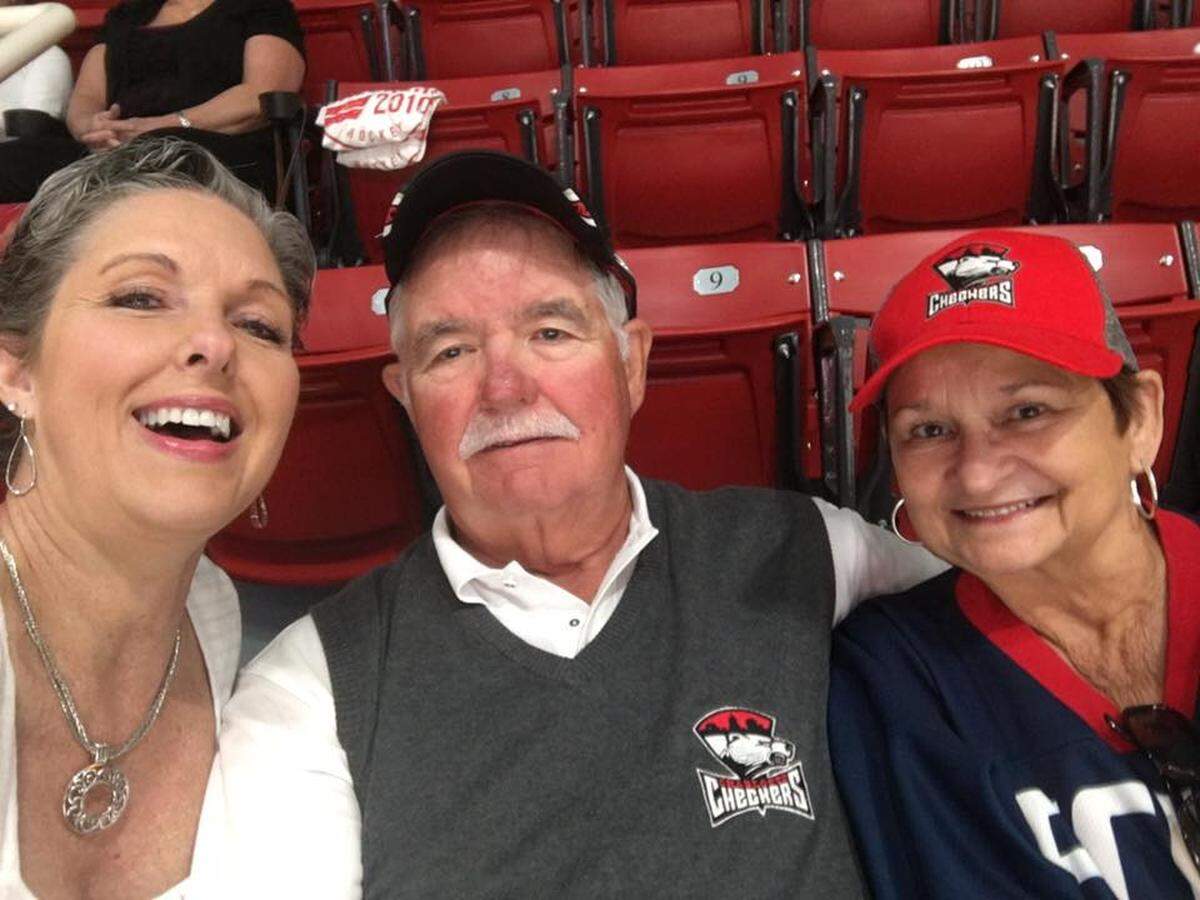 Jim Reddeck (center) and his wife Pam (right) met after a Charlotte Checkers game in 1976 and have since attended hundreds of games together. Their daughter Phelicia Nolan is also pictured.