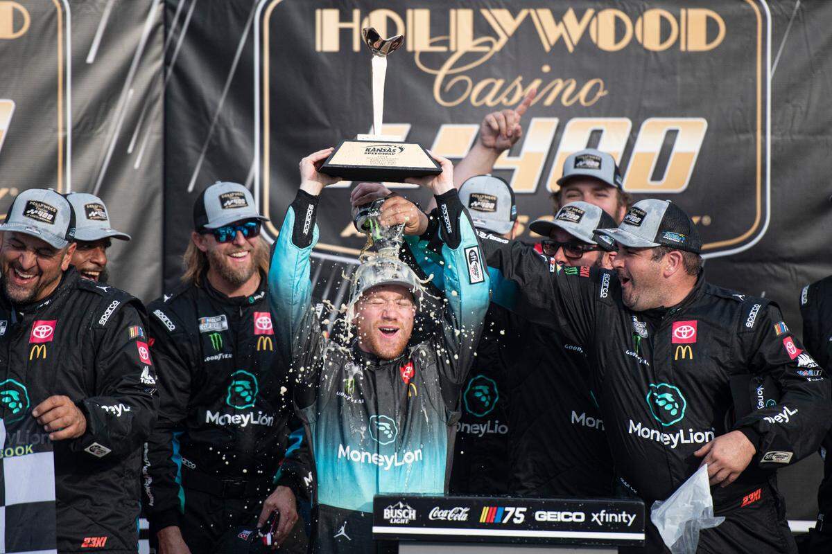Sep 10, 2023; Kansas City, Kansas, USA; NASCAR Cup Series driver Tyler Reddick (45) celebrates winning the NASCAR Cup Series Hollywood Casino 400 at Kansas Speedway. Mandatory Credit: Amy Kontras-USA TODAY Sports