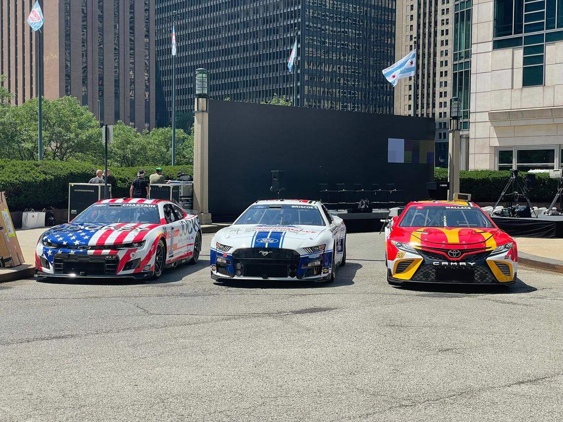 Chevrolet, Ford and Toyota cars are on display in Chicago on Tuesday ahead of the announcement of the NASCAR street race coming to the city in 2023.