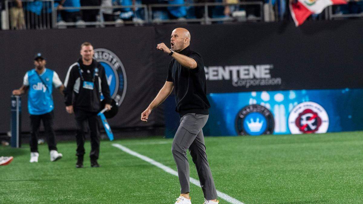 Charlotte FC head coach Miguel Ramirez pumps his fist and yells toward fans after a win against the New England Revolution at Bank of America Stadium on Saturday, March 19, 2022 in Charlotte, NC. Charlotte FC defeated the Revolution, 3-1, for their first win of the season.