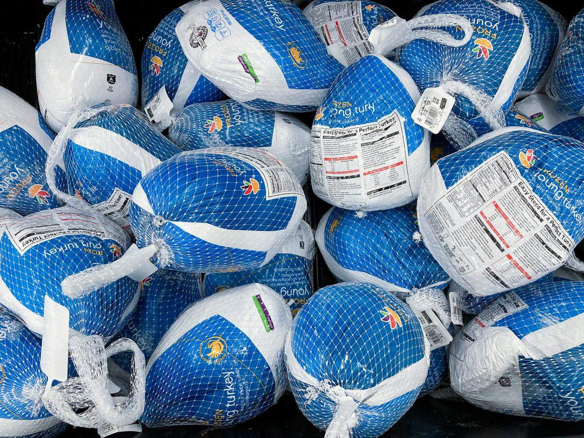 Frozen turkeys wait to be purchased at a grocery store in New Hope, Pa., Tuesday, Nov. 16, 2021. There is no shortage of whole turkeys in the U.S. this Thanksgiving. But chances are consumers could end up with smaller birds, according to supply chain expert Evan Nash of Johnson & Wales University in Charlotte.  