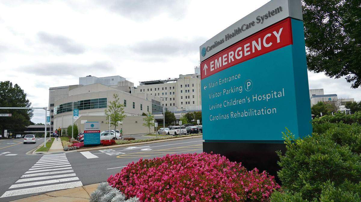 Atrium Health’s flagship hospital, Carolinas Medical Center, in Dilworth. Two Atrium Health urgent care clinics, in Davidson and Huntersville, were forced to close this past Sunday because of staffing shortages related to spring break, the hospital system said.