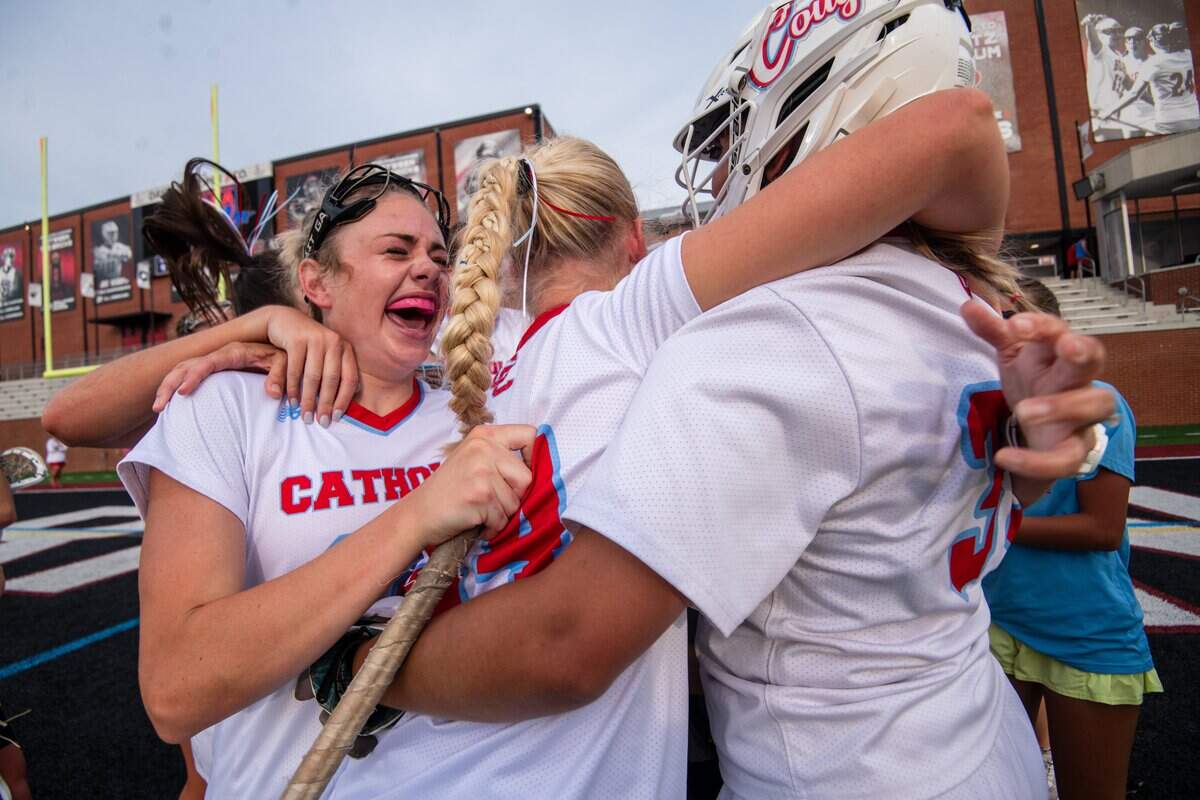 Charlotte Catholic players celebrate winning the 1-6A NCHSAA girls lacrosse finals, 9-8, after sudden-death overtime against East Chapel Hill at Lenoir-Rhyne University in Hickory, North Carolina, on Friday, May 29, 2026.