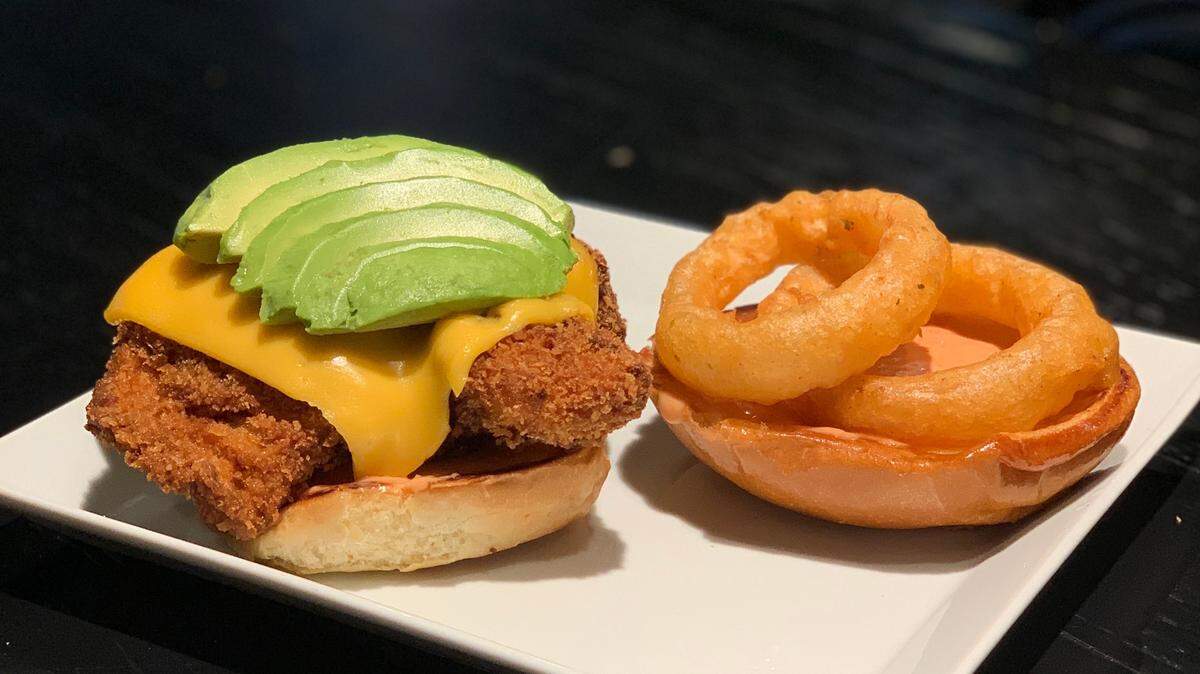 Midtown Tavern’s Ultimate Chicken Sandwich features fried chicken breast, avocado, Midtown aioli, an onion ring and a cheese blend.
