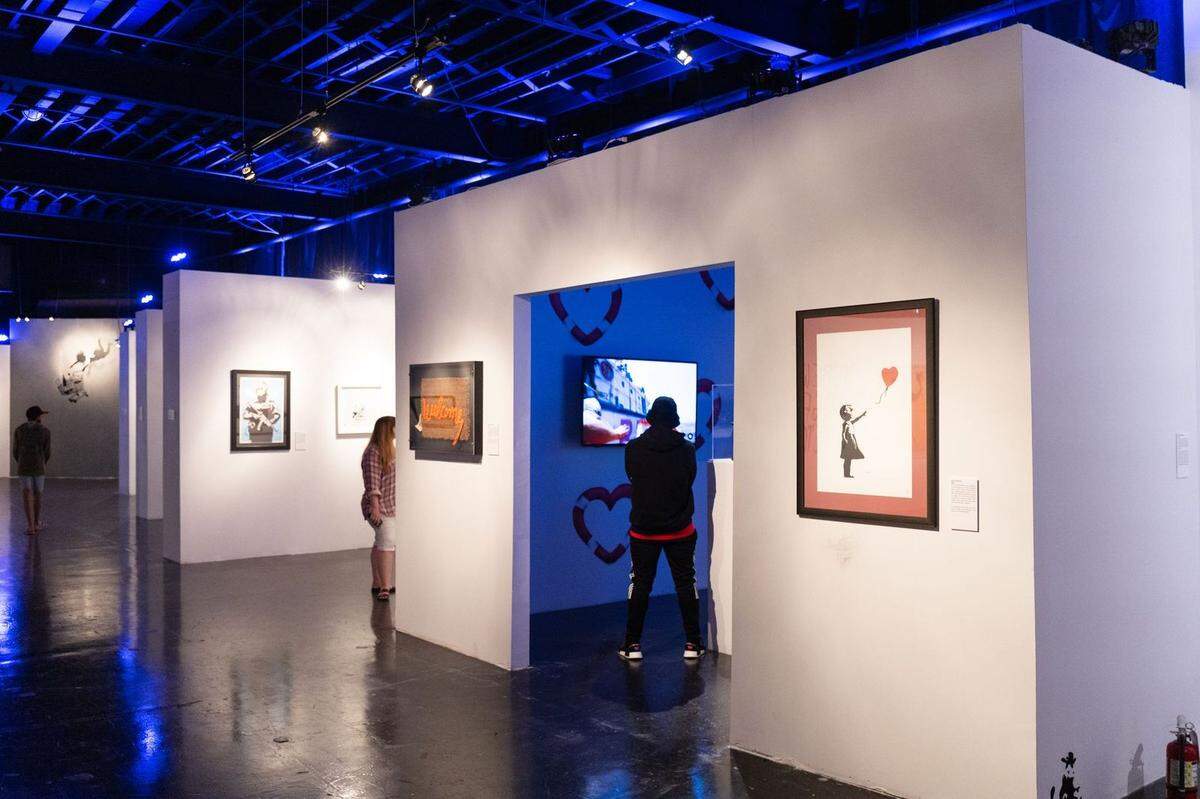 “The Art of Banksy: Without Limits” showcases more than 155 works, including prints, photos, sculptures, installations and murals — some of which were reproduced specifically for the exhibition.