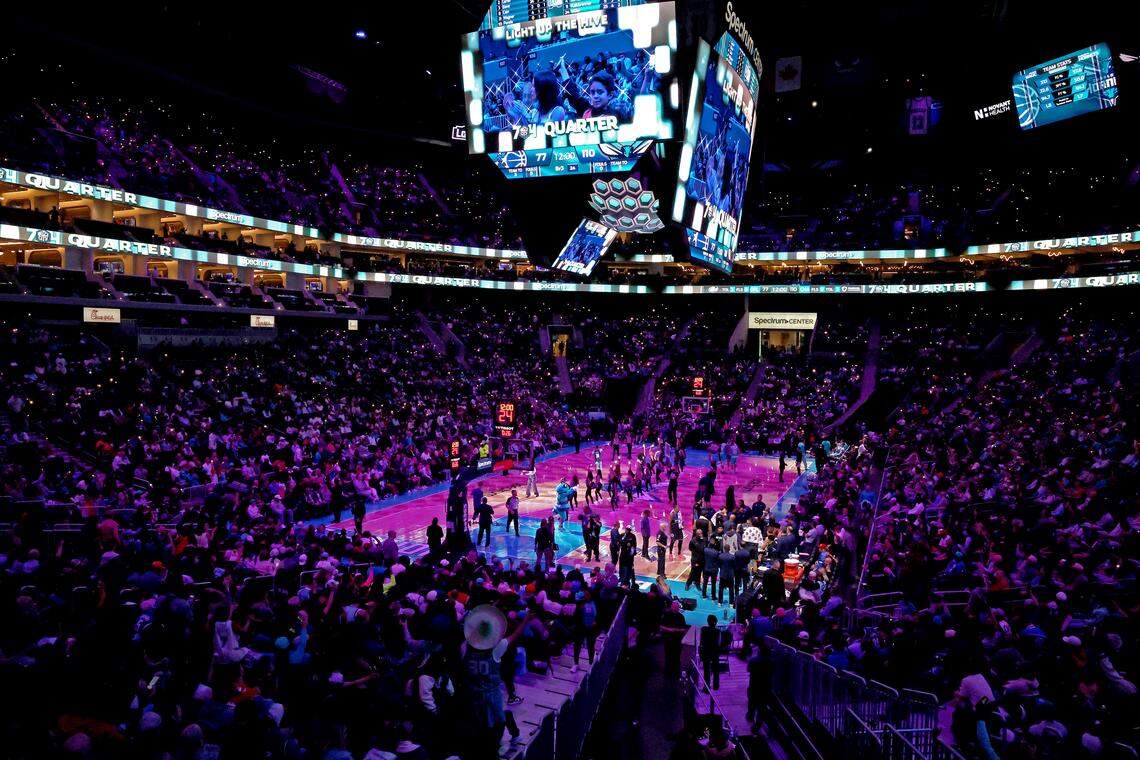Charlotte Hornets fans Light Up the Hive as the team prepares to open the fourth quarter against the Orlando Magic on March 19, at Spectrum Center in Charlotte. The Hornets won 130-111.