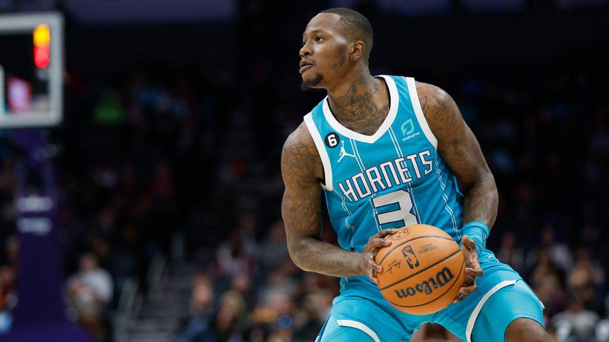 Charlotte Hornets guard Terry Rozier looks to shoot against the Cleveland Cavaliers during the first half of an NBA basketball game in Charlotte, N.C., Sunday, March 12, 2023. (AP Photo/Nell Redmond)