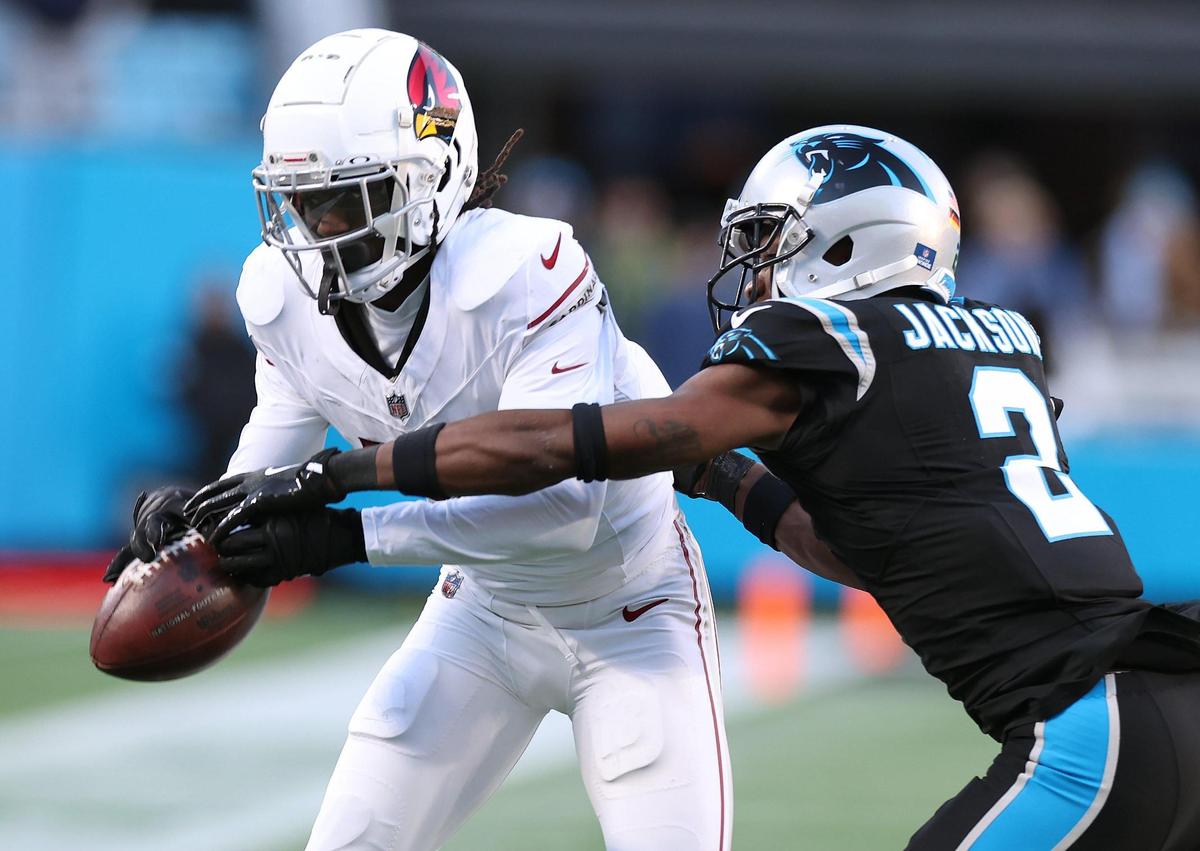 Carolina Panthers cornerback Mike Jackson, right, knocks the ball away from Arizona Cardinals wide receiver Marvin Harrison Jr., left, during action at Bank of America Stadium in Charlotte, NC on Sunday, December 22, 2024. The Panthers defeated the Cardinals 36-30 in overtime.