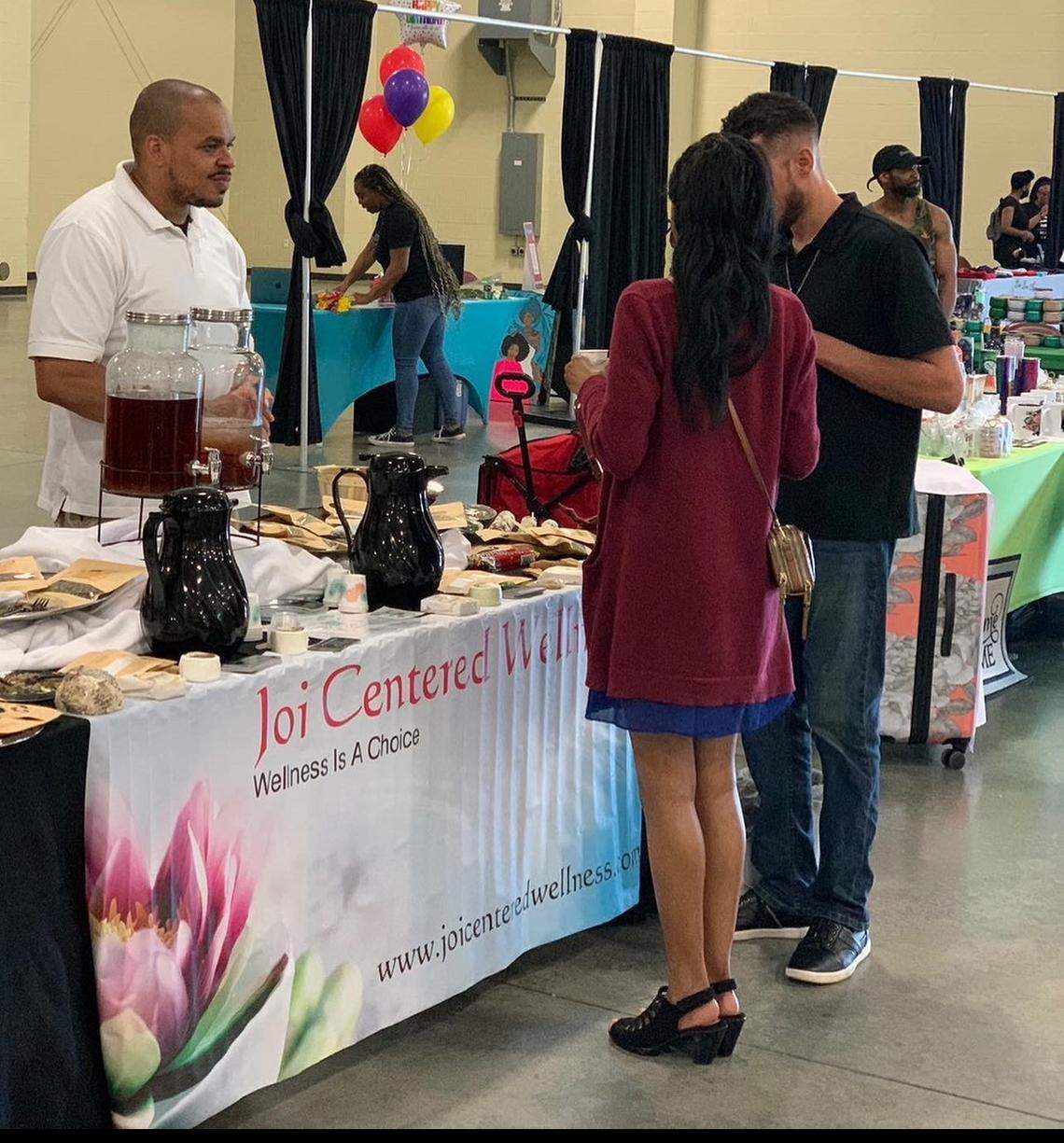 Customers at a marketing event hosted by Nxt Big Thing Charlotte interacts with Joi Centered Wellness. The Charlotte-based organization is hosting an expo for Black businesses on Saturday.