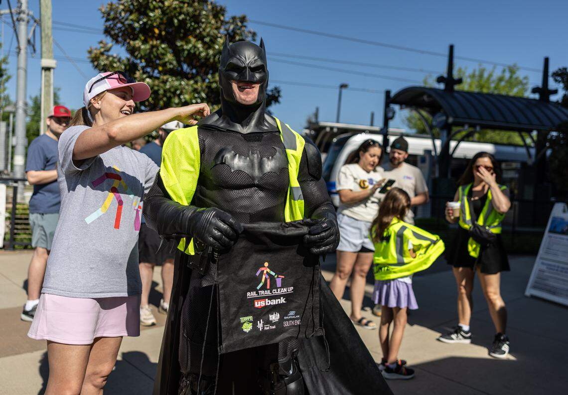 The Batman of Charlotte volunteers to pick up trash along the Charlotte Rail Trail in Charlotte, N.C., on Saturday, April 18, 2026.