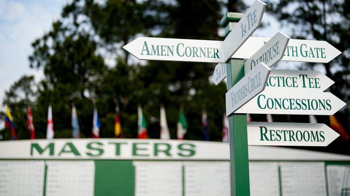 Signage directs patrons on the course for the Masters Tournament at Augusta National Golf Club