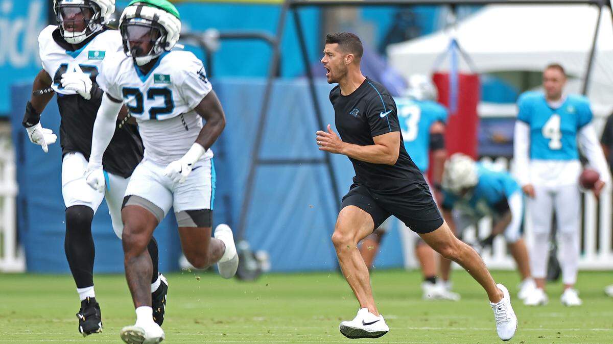 Carolina Panthers head coach Dave Canales, right, runs through special teams drills with the players during practice on Tuesday, August 6, 2024.