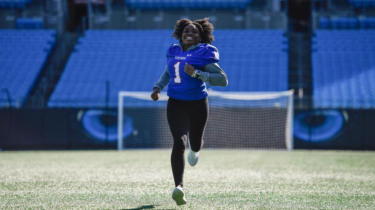 Breana Fowler of North Mecklenburg High runs the length of the 100-yard football field at Bank of America Stadium on Tuesday in Charlotte. Fowler will play in the new high school girls flag football league started by Charlotte-Mecklenburg Schools and the Carolina Panthers.