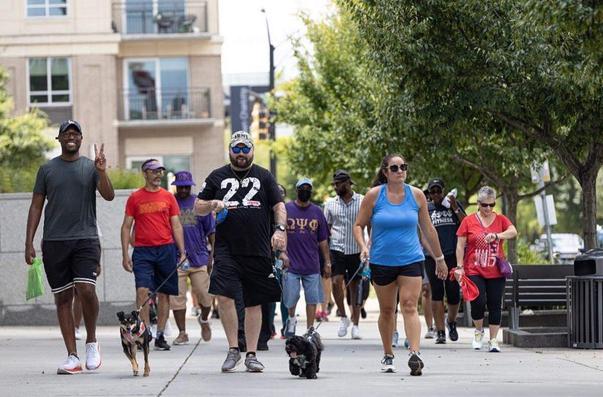 People walk uptown to bring awareness to veteran suicide during the U.S. Veterans Hall of Fame’s fourth annual Walk to Fight Suicide on Saturday Aug. 6, 2022. The event saw lower turnout than previous years due to a parking issue.
