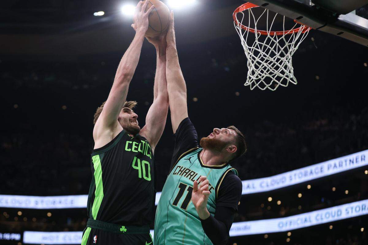 Charlotte Hornets center Jusuf Nurkic (11) blocks a shot by Boston Celtics center Luke Kornet (40) during the first half at TD Garden.