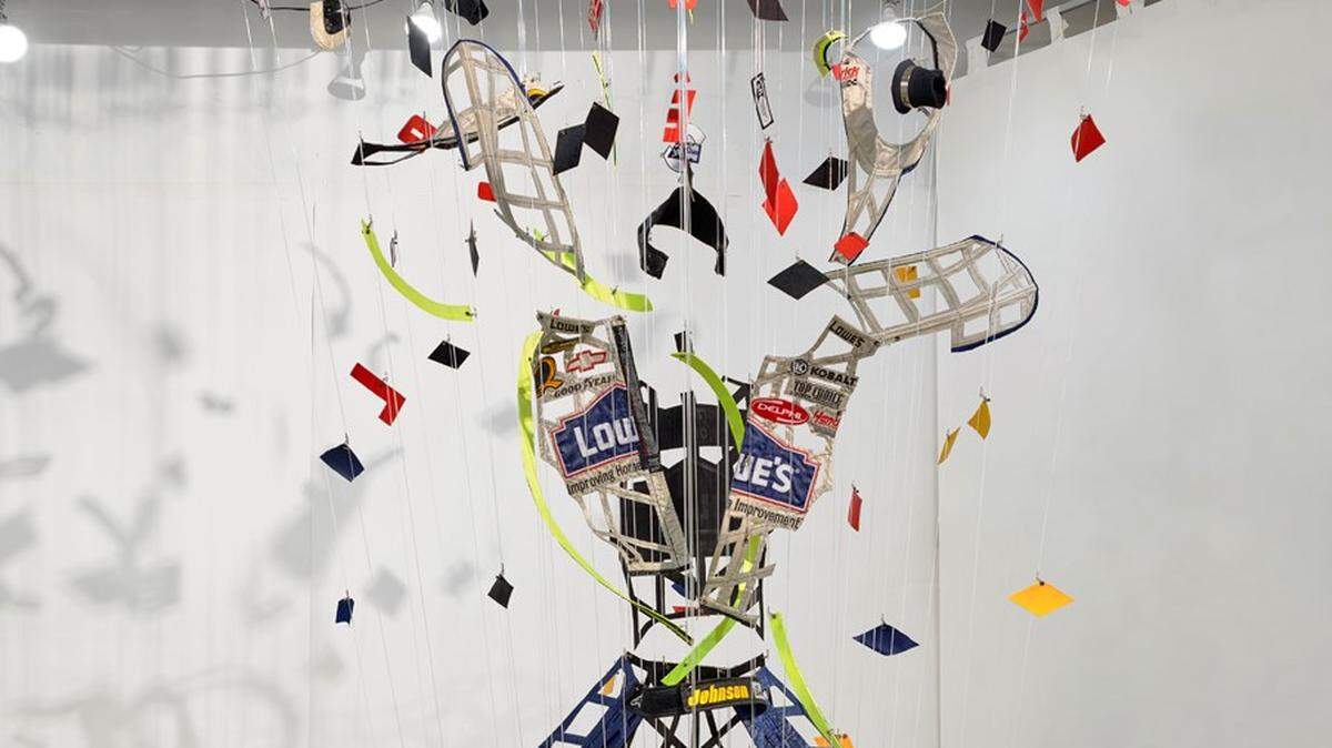 A close-up view of “Daytona Vortex,” the art installation using NASCAR driver Jimmie Johnson’s 2006 Daytona 500 racing suit. That was the first 500 that Johnson won in his long career.