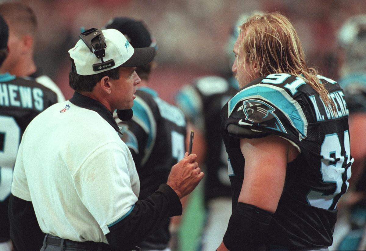Carolina coach Dom Capers, left, talks with Kevin Greene on the sidelines. In Capers’ 3-4 system, Green thrived and led the NFL in sacks in 1996.