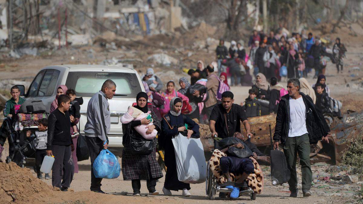 Palestinians flee south on a road in the Gaza Strip on Nov. 26, 2023, the third day of a temporary cease-fire between Israel and Hamas.
