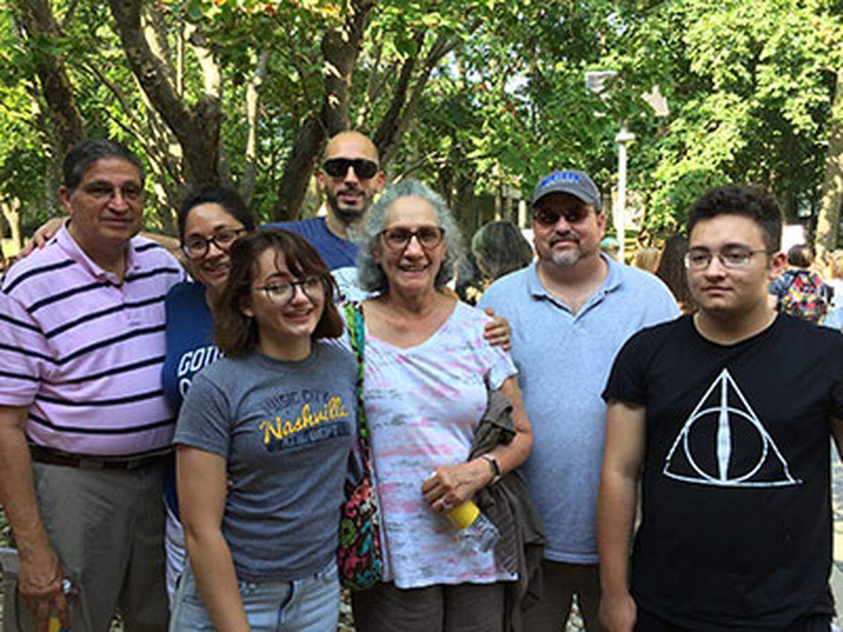 Dina Fernandez, center, is pictured with her family.
