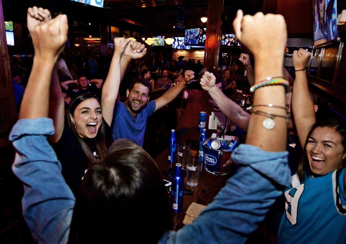 Fans at All American Pub get vocal when their teams do well.