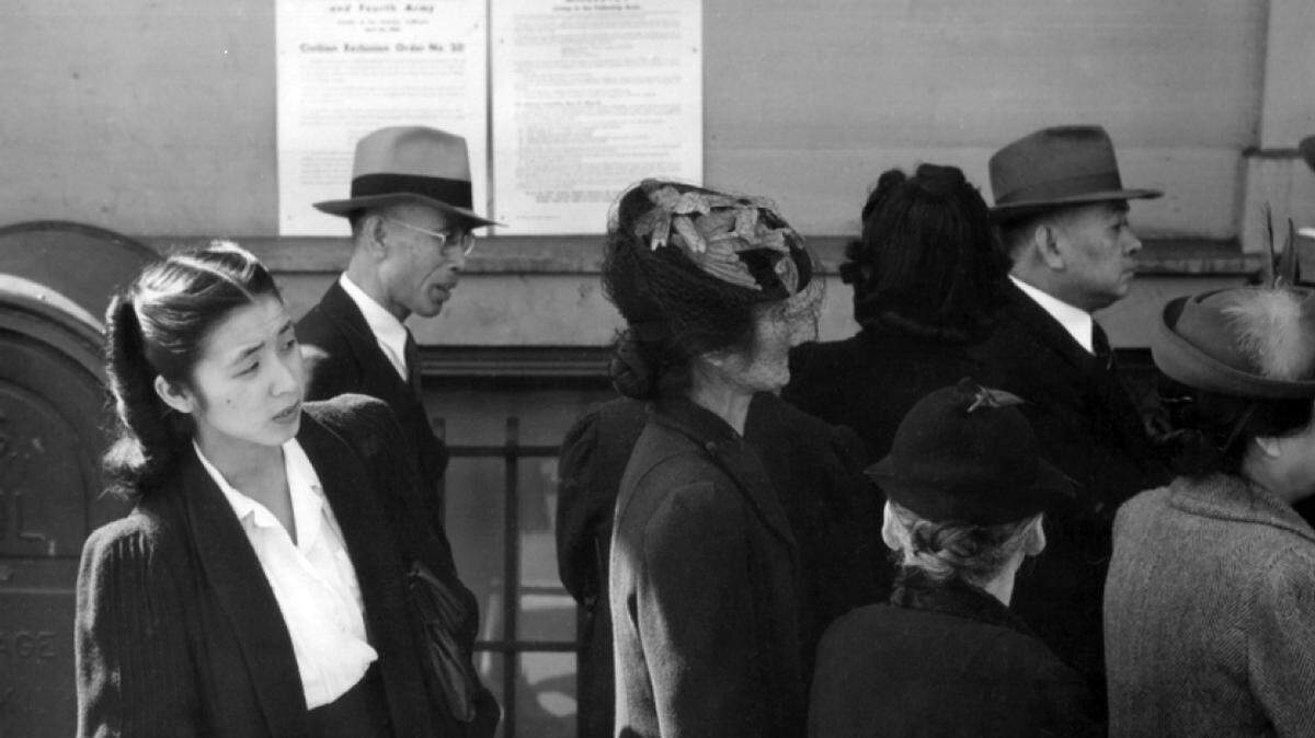 Residents of Japanese ancestry appear for registration prior to evacuation on April 25, 1942 in San Francisco, Calif.