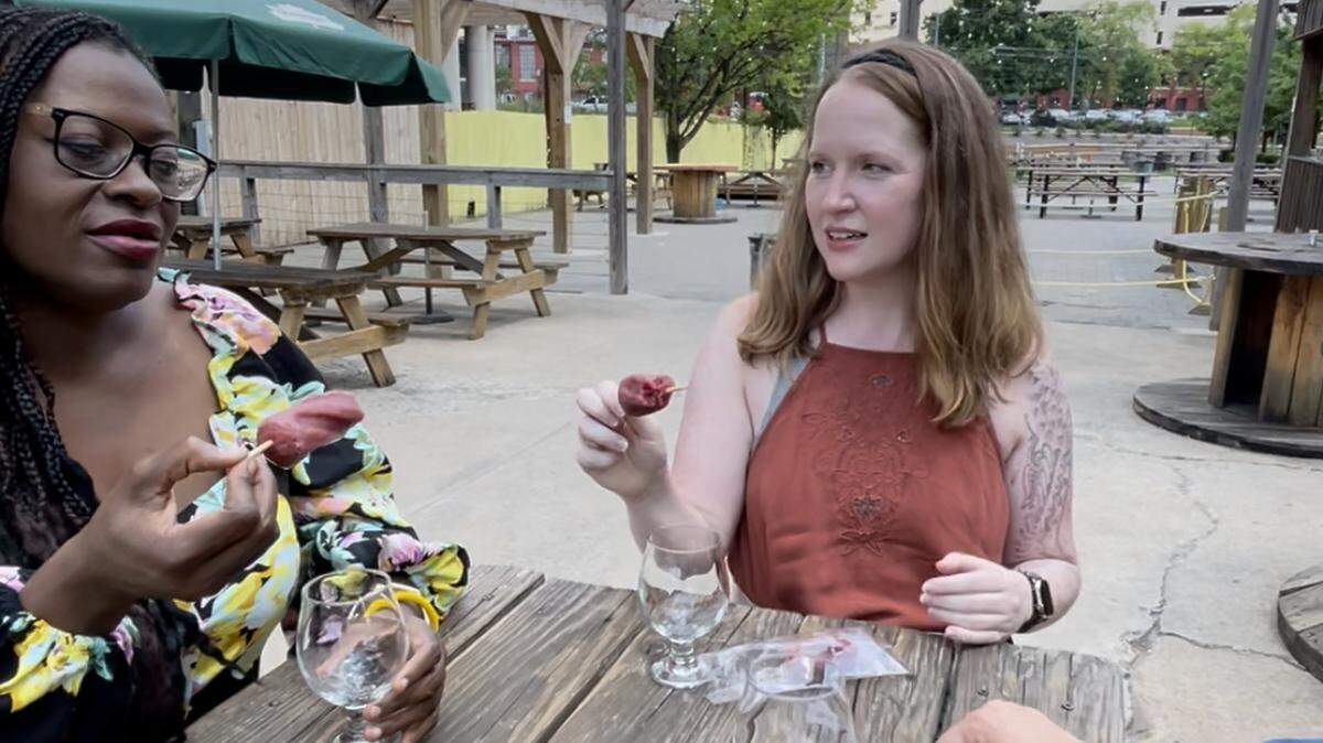 CharlotteFive’s Emiene Wright and Melissa Oyler taste Sycamore Brewing’s new Boozenberry Boozy Pop on Thursday at the brewery.