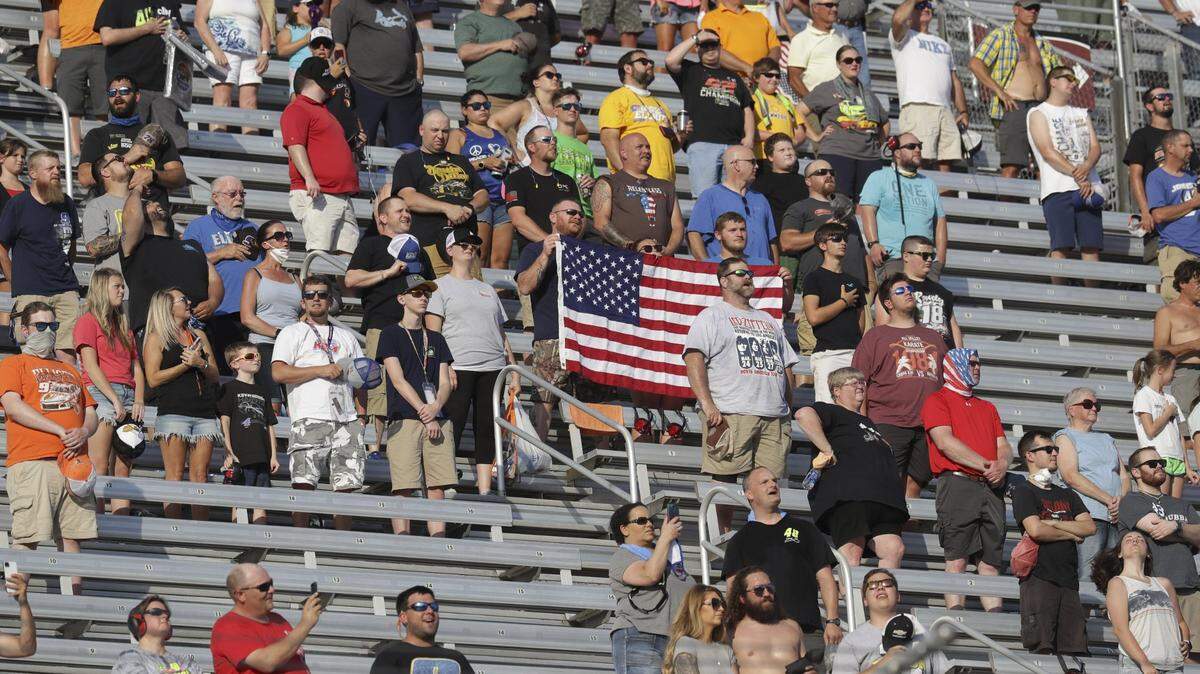 Fans wait for the start of NASCAR’s all-star race Wednesday night at Bristol Motor Speedway in Tennessee. The crowd of approximately 25,000 was the largest at an American sporting event since the COVID-19 pandemic.